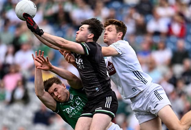 Fermanagh goalkeeper Sean McNally, supported by team-mate Ronan McCaffrey, left, in action against Kevin Feely of Kildare during the Tailteann Cup semi-final at Cro