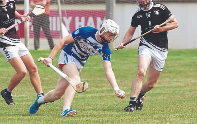 Naas Charlie Sheridan wins possession ahead of Maynooth Fiachra Lohan