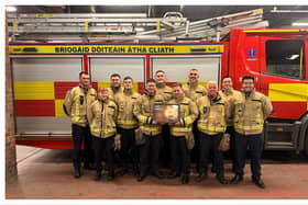 Dolphins Barn firefighters with their award from PETA