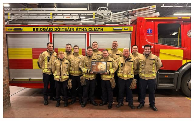 Dolphins Barn firefighters with their award from PETA