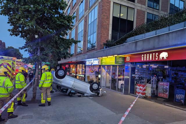 PHOTOS: Car falls onto footpath after leaving roof car park