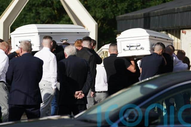 Funeral of three siblings who died in attack in home takes place