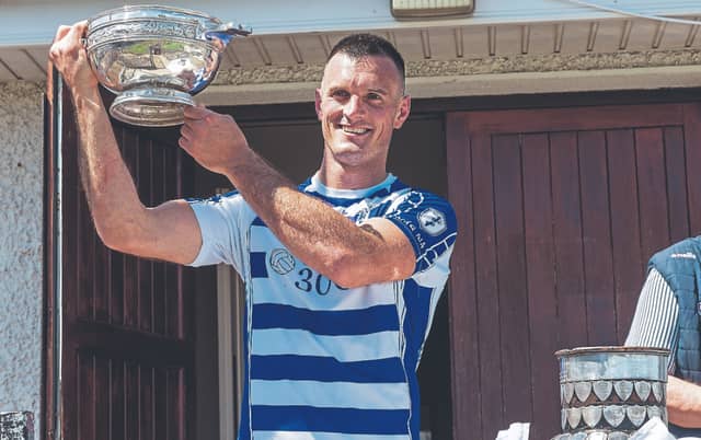 Naas captain, Eoin Doyle, lifts the Leinster Leader Cup, after his side defeated Athy in the Senior Football League Division 1 final on Sunday at St Conleth's Park, Photo by Sean Brilly