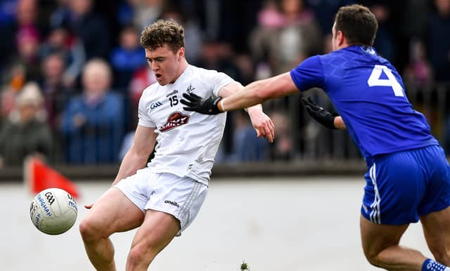 Jimmy Hyland of Kildare scores a point under pressure from Ryan Wylie of Monaghan in the AFL Division 1 match at St Conleth's Park