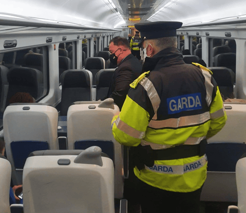 A garda on patrol in a train carriage / PHOTO; KILDARE GARDA DIVISION