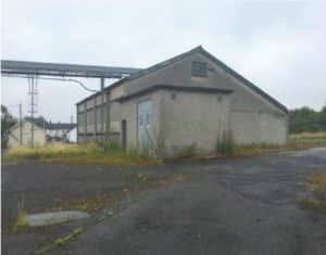 The Site is approx. 1.6 ha made up of various vacant industrial buildings of approx. 2,408 sq. m., storage silos and circulation space.