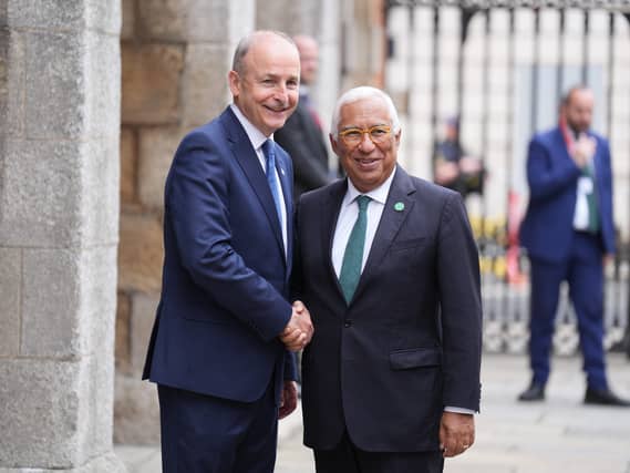 Micheal Martin and Antonio Costa smiling and shaking hands