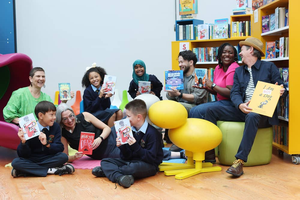 Photographed at the launch of The Best Irish Books of 2026 are Ladan, 7, Casey, 11, Yannaty, 8, and Koby, 8, pupils from Scoil Treasa Naofa in Dublin 8, along with Senior Librarian at Kevin Street Library, Neasa McHale. Also photographed are featured artists from Best Irish Books of 2026: Zainab Boladale, author of 'Looking for Aurora' (The O'Brien Press);  Peter Donnelly, author and illustrator of 'I am not a Dog'(Gill Books);  Johnathan Sung, author and illustrator of 'Moon Moon Can't Sleep' (Bad Book Press);  Jen Wallace, author of 'Project Dinosaur' (Little Island Books); and  Máire Zepf, author of 'Dearg' (Futa Futa)