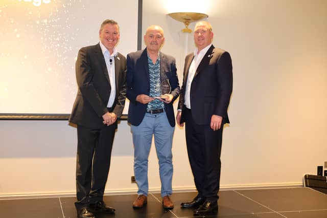 Kenneth Aldridge (middle) pictured with Richard Sykes, SVP and President, UK & Ireland (left) and Dinny Crowe, Vice President, Operations, ABM (right) receiving his award at the One ABM Awards
