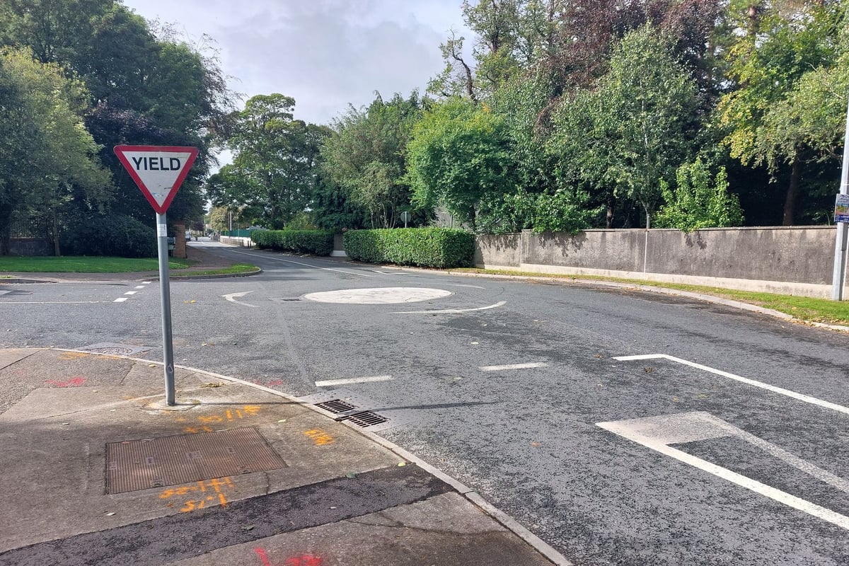 Motorists are driving through a roundabout near Kildare school