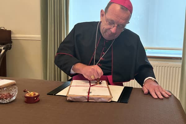 Bishop Tom Deenihan, Bishop of Meath, sealing the official records for the Cause of the Canonisation of Father Willie Doyle SJ 