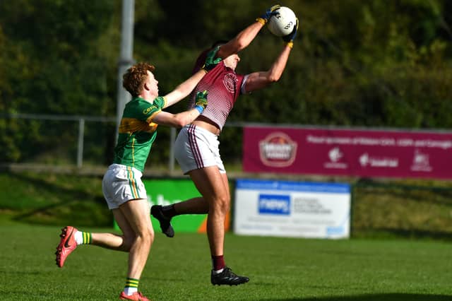 Caragh midfielder Dan Lynam fields the ball against Kilcock