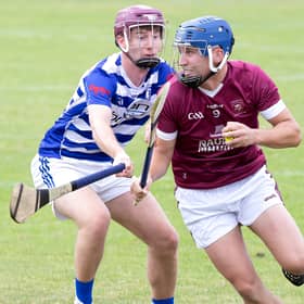 Leixlip midfielder Eoghan Harrington shakes off the challenge from Sean MacDonncha of Naas in 2026 IHC action
