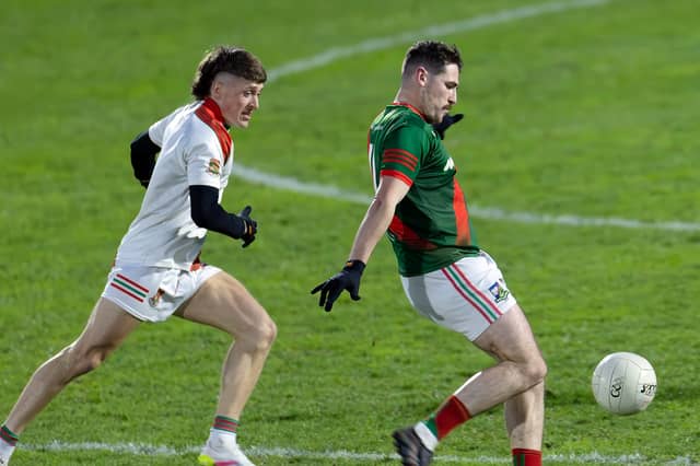 Milltown Alan Dignam openings the scoring of the Intermediate Football Championship 2026 with a point from play after he goes past Suncroft Chris Philips