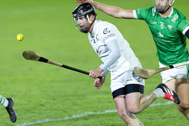 Clane forward Paddy McKenna wins possession ahead of Paul Divilly of Confey