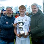 Clane Captain Eoghan Little accepts the Minor Hurling A Championship Cup from David Cahill Kildare GAA and Ronan Burns from Future Ticketing 