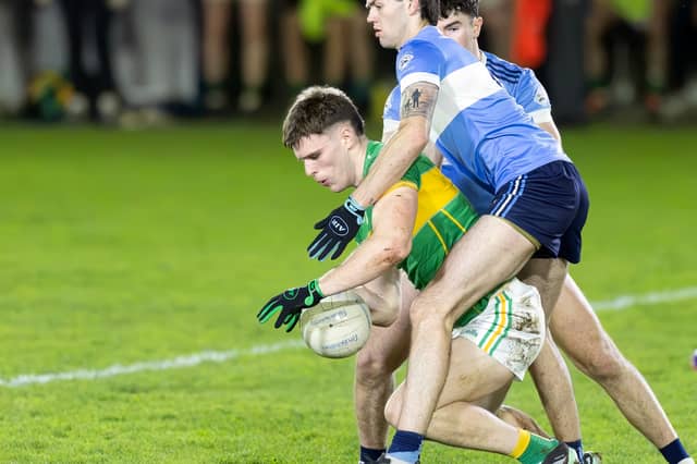 Kilcock midfielder Brendan Gibbons comes under pressure from the tackling John Dee Allenwood
