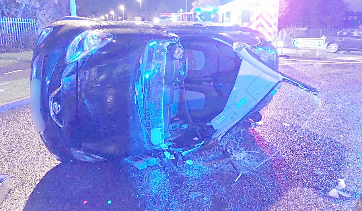 Firefighters cut windscreen to remove occupant from rollover car