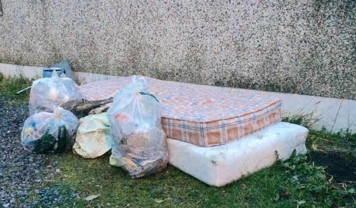 Mattress and household rubbish dumped outside Christmas Tree recycling