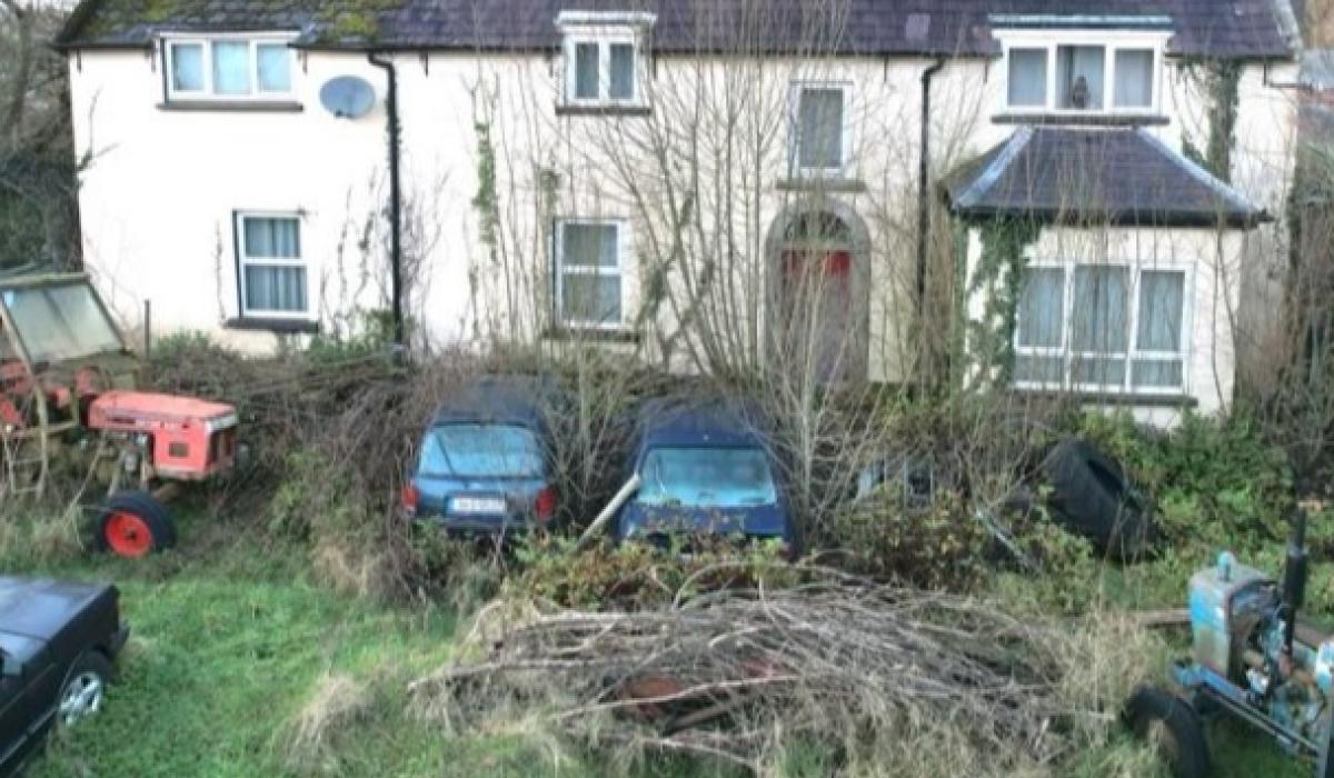 CAN YOU BELIEVE IT?! Dumped cars and tractors in front garden of house