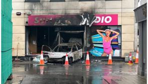 Gardaí investigate after car ploughs into premises and catches fire near Kildare-Carlow border