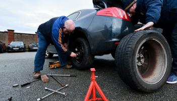 JUST MADE IT: Clare supporters change a flat tyre outside St Conleth's Park ahead of Kildare clash