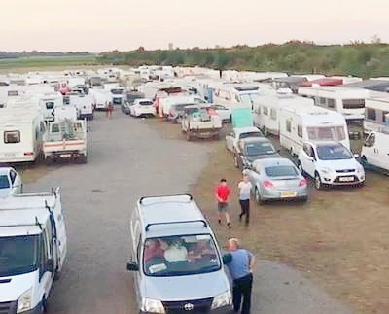 Born-again Travellers hold Christian prayer meeting in field beside M7 