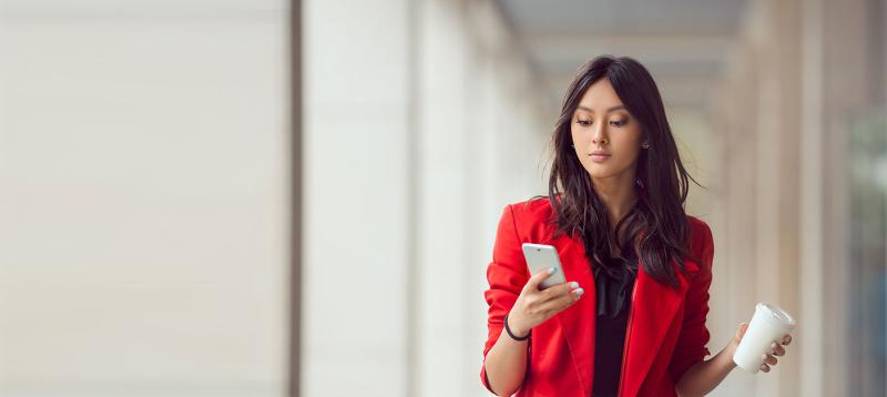 woman walking with mobile phone