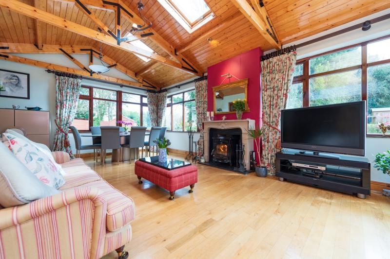 River with waterfall runs through garden of Kildare home