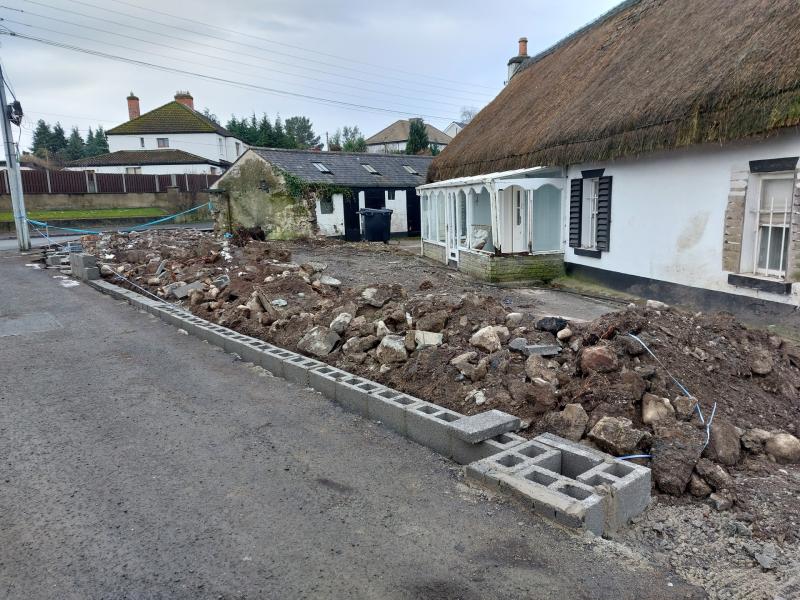 Council orders work to stop after wall removed from historic Kildare thatched house