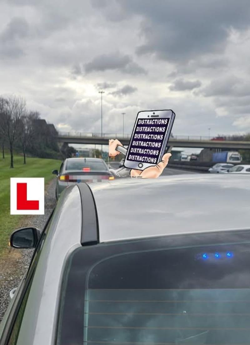 Kildare learner permit driver was holding a mobile phone and  vehicle seized
