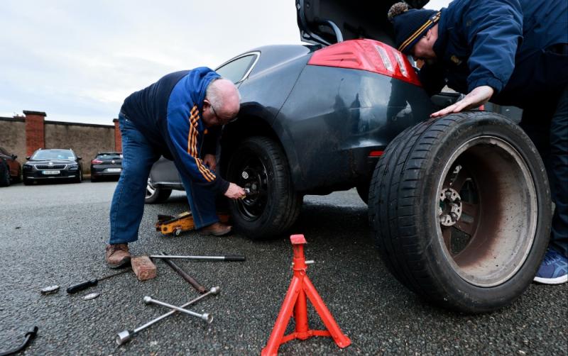 JUST MADE IT: Clare supporters change a flat tyre outside St Conleth's Park ahead of Kildare clash