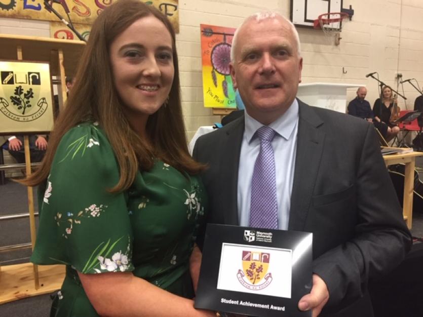 Sarah O'Rourke receives the prestigious NUI Maynooth Award for exceptional Academic Achievement from Mr. Collins, Principal of St. Farnan's
