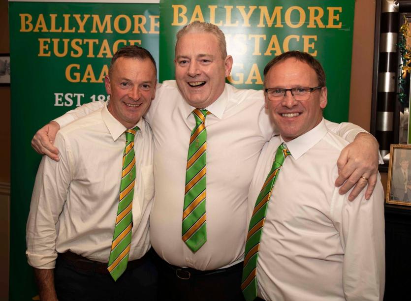 A big hug from GAA author and member of the 1994 Intermediate teams, Henry Murphy for captains Patrick Doyle and Paul Murphy