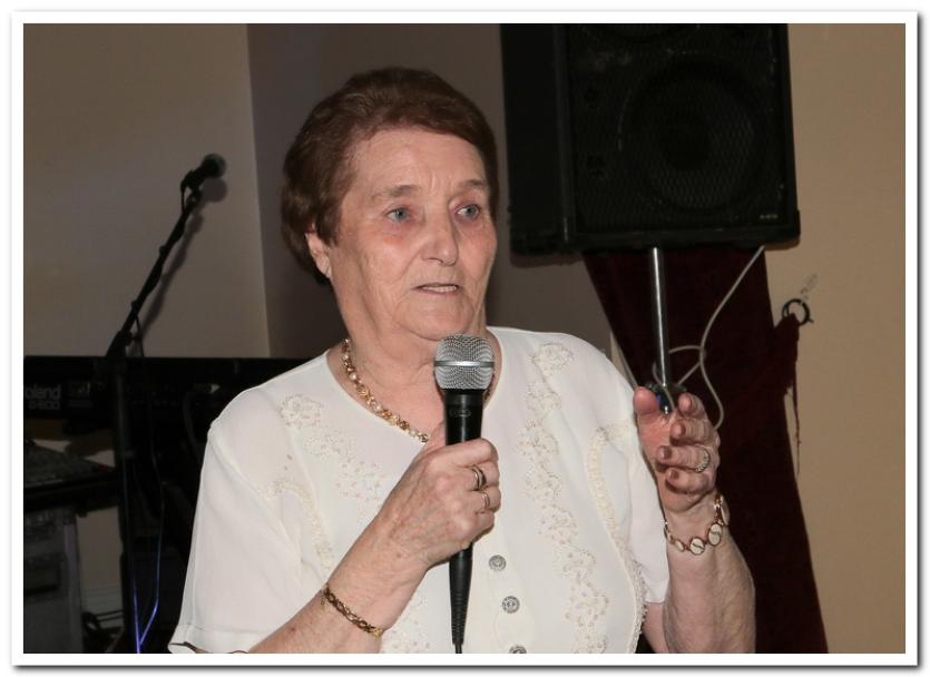 Kathleen entertaining her guests with one of her favourite songs.