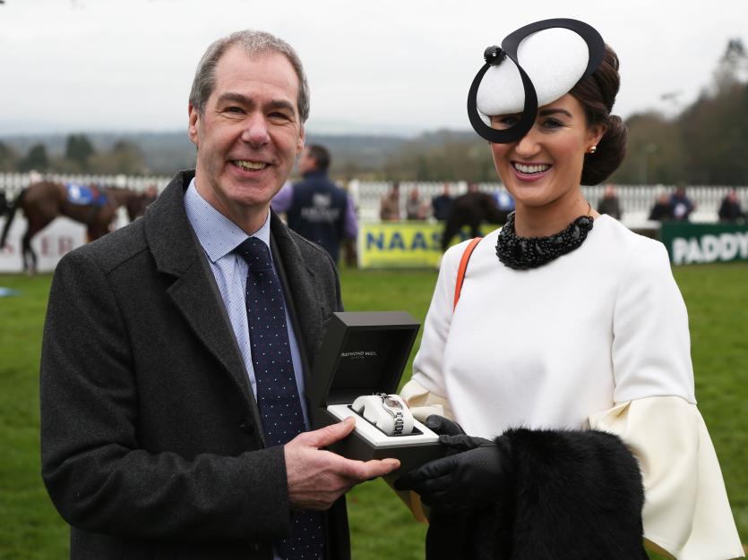 Hugh Statham presents a watch to the Best Dressed Lady Hannah Crosse