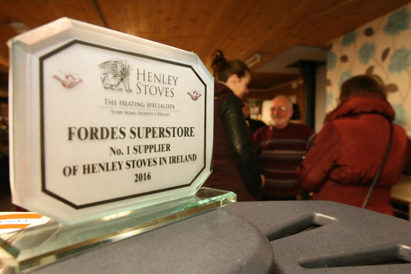 The award presented to Fordes Superstore by Henley Stoves.