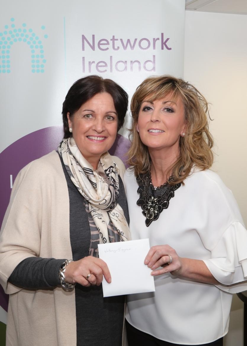 Pauline Forde,right, presenting a thank you gift to Kathryn Byrne.