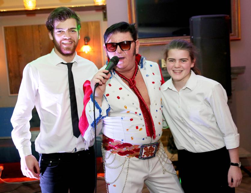 Elvis Tribute Greg Traynor with bar staff Tom and Emer Glynn