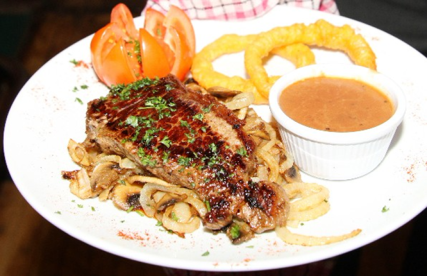 Steak and Mushrooms with Peppercorn Sauce.