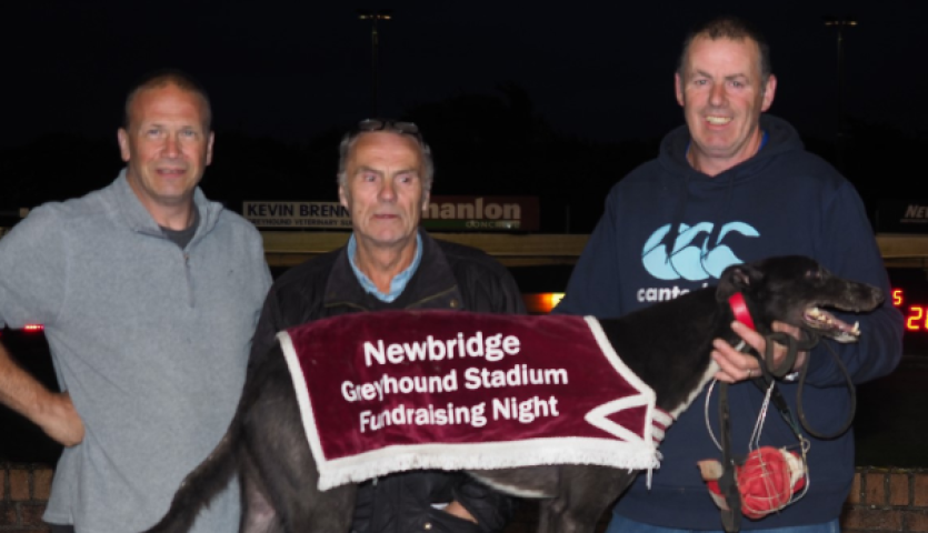 Kildangan GAA 1 L to R Des Smith, Trainer, Liam O'Connor owner and James McGuinness, Kennel Hand with the winning dog DOONANES BARN.