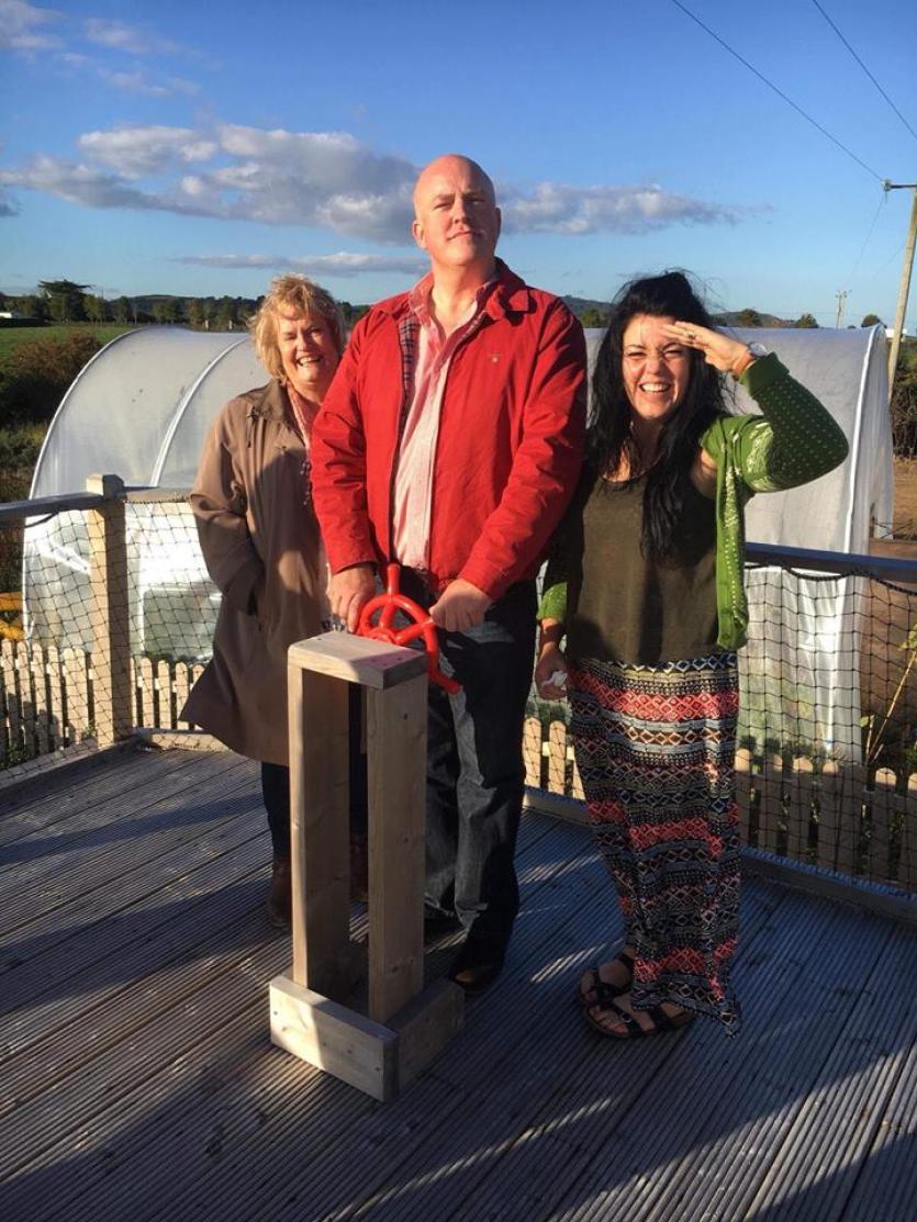 Aubrey McCarthy steering the ship at Tiglin Ladies Pirate Ship, with support worker Thelma and Rose B O'Donoghue