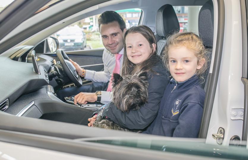 Nicholas Mulhall with Emily and Rosie and Showroom mascot Paudie the puppy