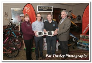 Aisling and Michael McLoughlin of McLoughlin's Cycles with Marin Kaminski and Darren Burke holding the latest craze in personal transport...the Futurefoot.