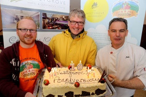 General Manager Gerry Russell with William O Reilly and Head Chef John Carolan holding a cake celebrating the Westgrove Hotels 10th Anniversary