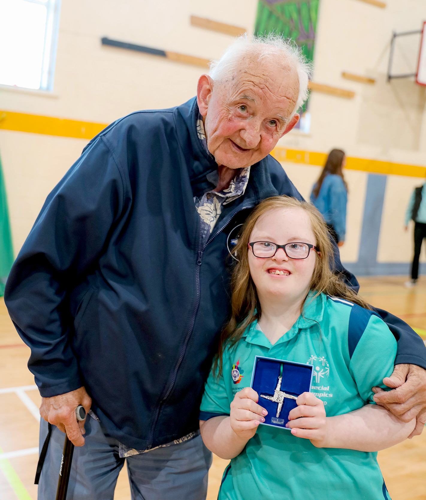 Joe Clancy presents Grace Kavanagh with a St Brigids Cross